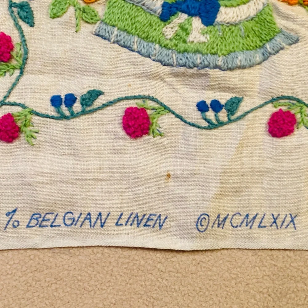 Beautiful small sampler of newborn child, knitted in colorful needlework linen